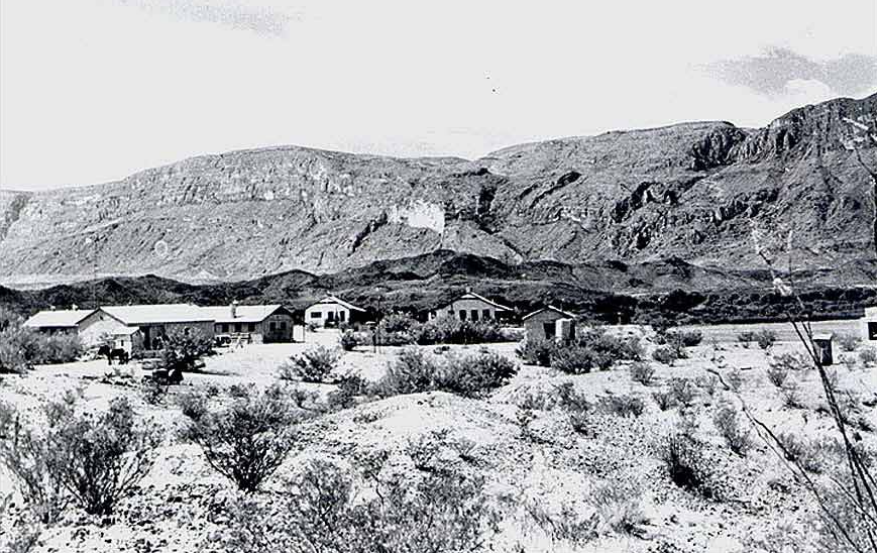 A cluster of buildings next to mountains