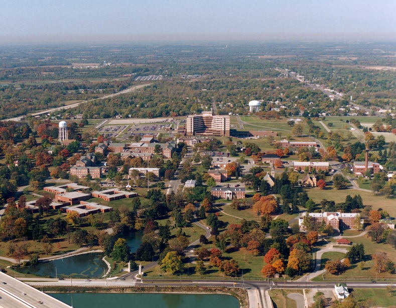 Aerial view of Central Branch NHDVS Aerial view of buildings, trees, and lakes.