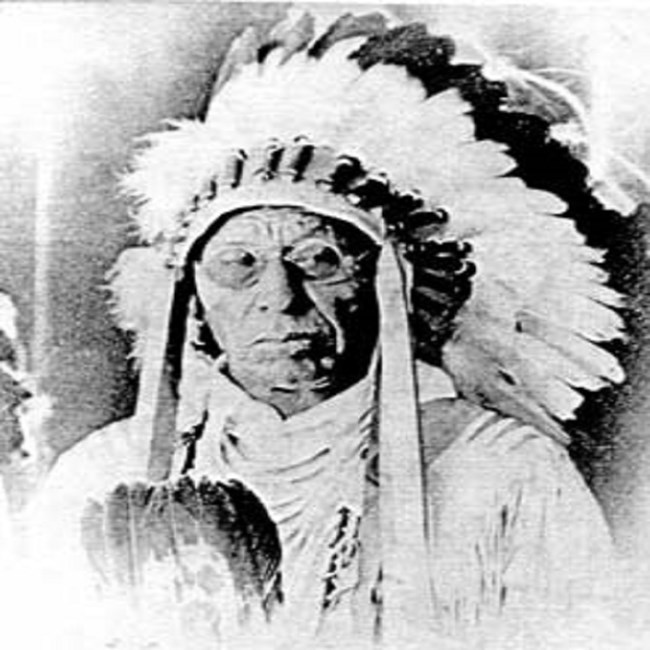 Portrait of Chief Four Dance in full headress