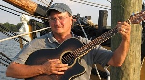 Chris Cerino holding his guitar Chris Cerino holding his guitar
