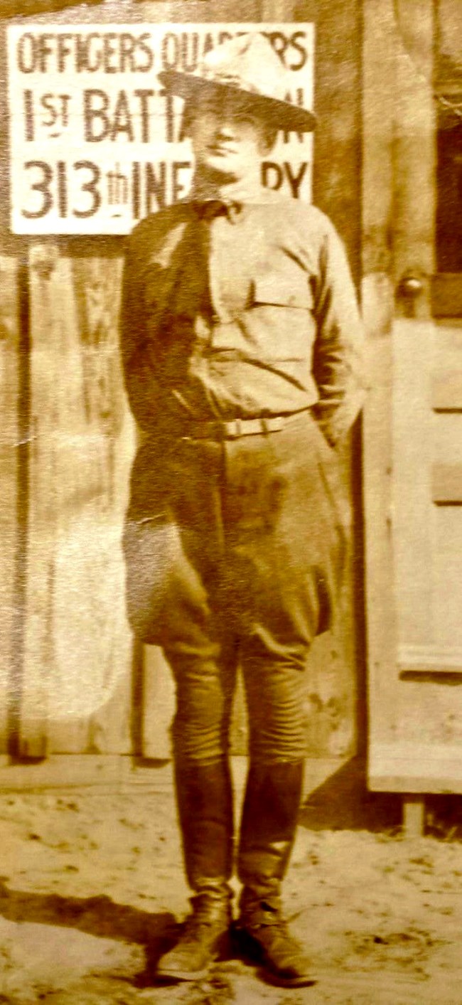 Soldier standing with hands behind back