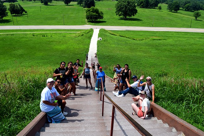 Students walk up steps. Students walk up steps.