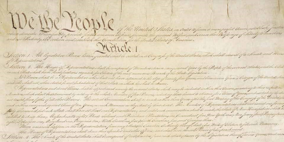 Color image of the top half of the handwritten U.S. Constitution.