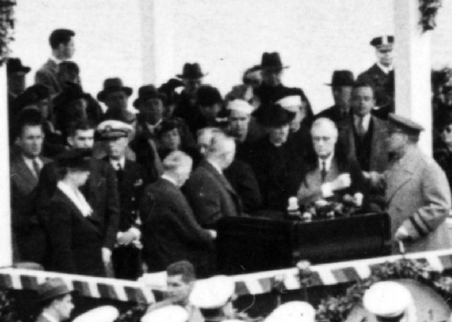 Crowd zoom crop Franklin Roosevelt at podium for dedication of Jefferson Memorial