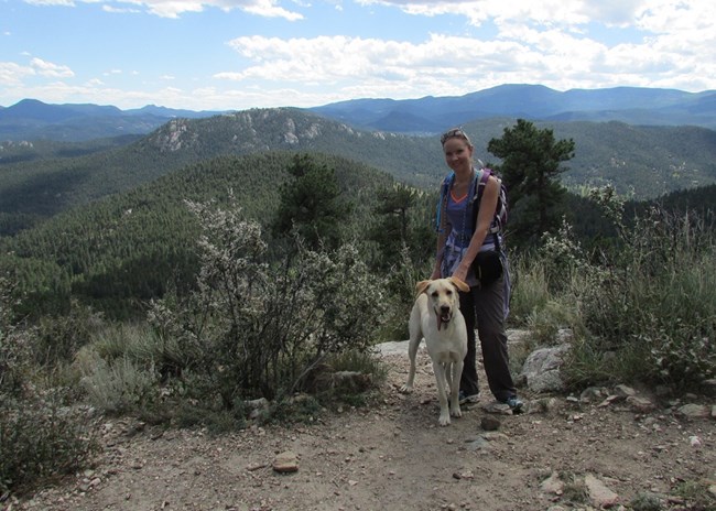 Crystal Harmon with her dog, Yogi, hiking in Evergreen Colorado.