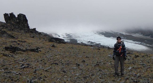D Devenport surveying ice patches on a mountain top for artifacts D Devenport surveying ice patches on a mountain top for artifacts