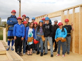 Youth group wearing hard hats