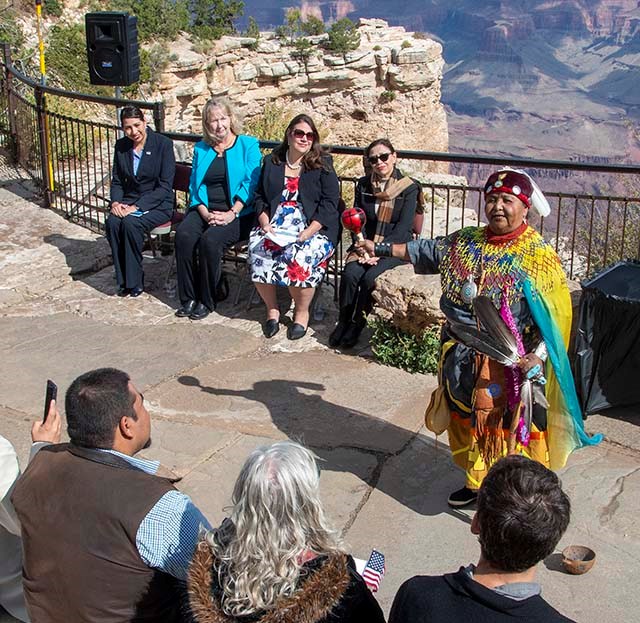 The Havasupai are one of the 11 tribes traditionally associated with the Grand Canyon, and are known as the guardians of the Grand Canyon. Havasupai elder wearing colorful clothing and holding a rattle and feathers is conducting a welcome ceremony.