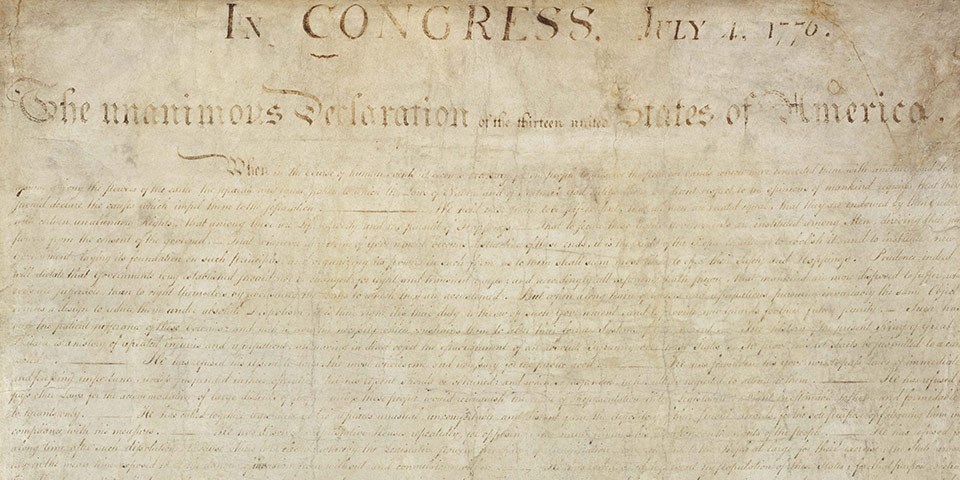 Color image of the handwritten Declaration of Independence showing faded brown text on cream paper. Color image of the handwritten Declaration of Independence.