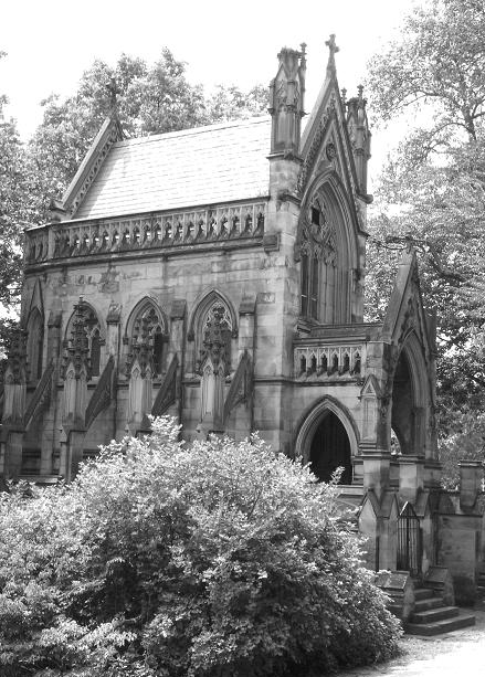 B&W photo of a building with a cross at the top.