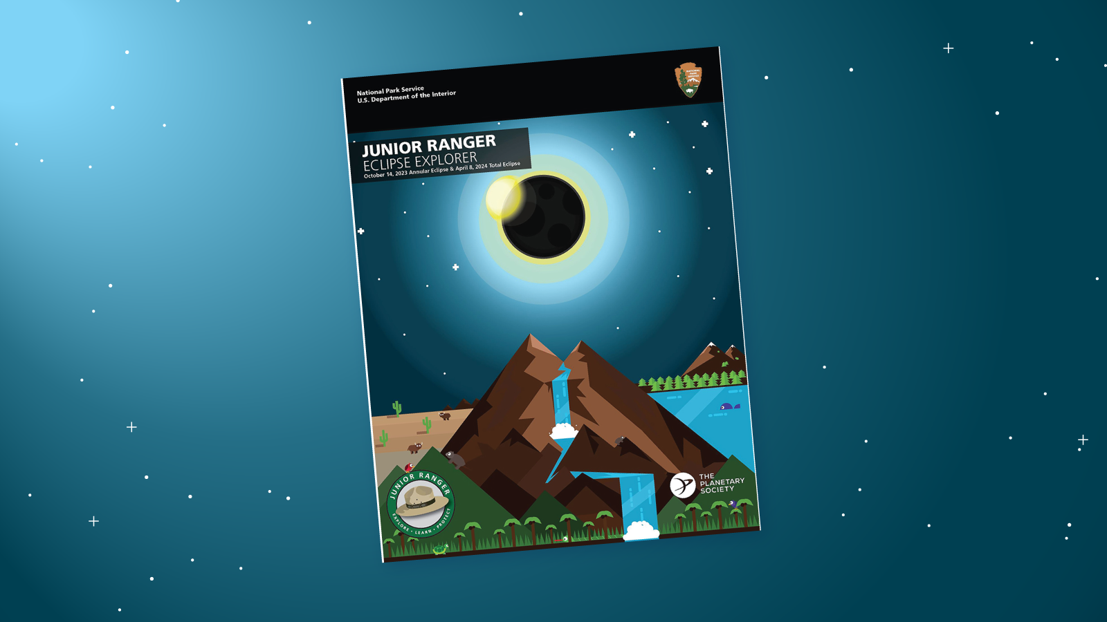 The Eclipse Explorer Junior Ranger book on a night sky blue background. The booklet features a colorful graphic design of an eclipse over a mountain. Logos: The Planetary Society, NPS, Junior Ranger