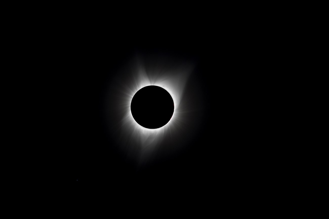 TotalEclipse_DamonJoyce Luminous wisps of the sun's corona rim the darkened sun in this view of the 2017 total solar eclipse.