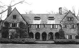 B&W photo of a large, three level house.