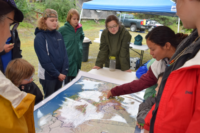 Environmental Education Internship in Alaska’s Copper River Valley students gather around a map