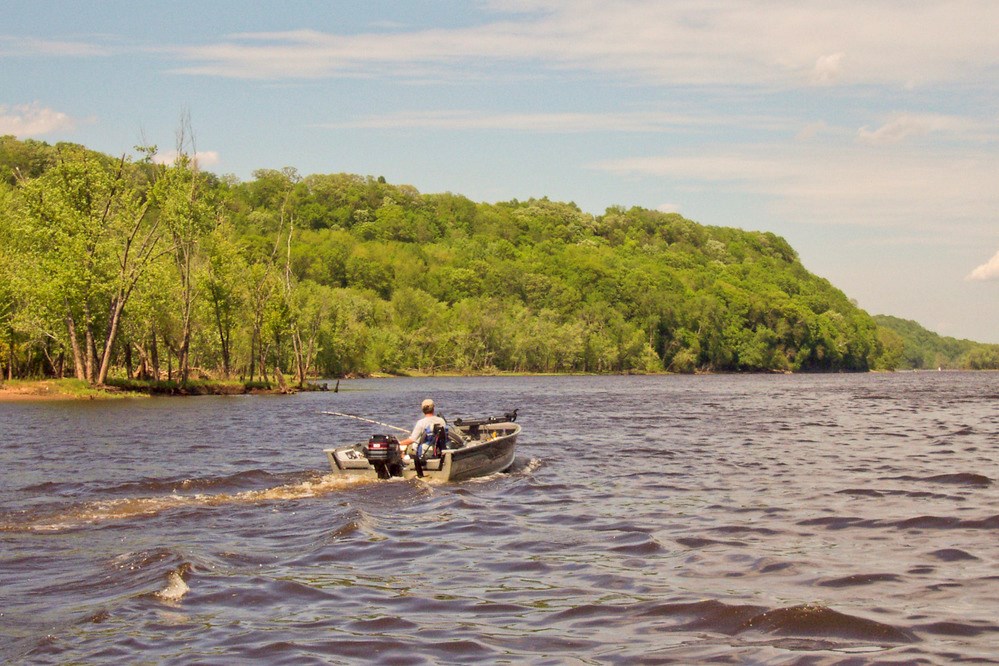 a motor boat speeding through a rippling river