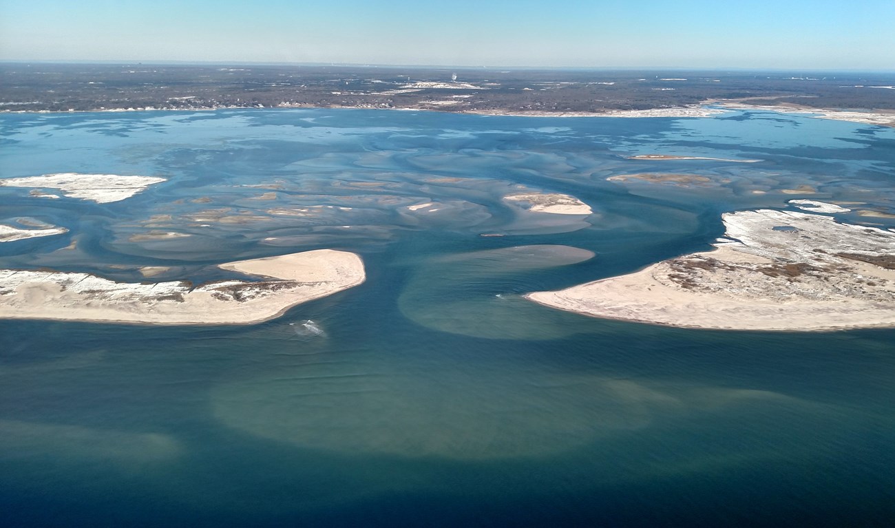 an aerial view of the breach that was caused by Hurricane Sandy