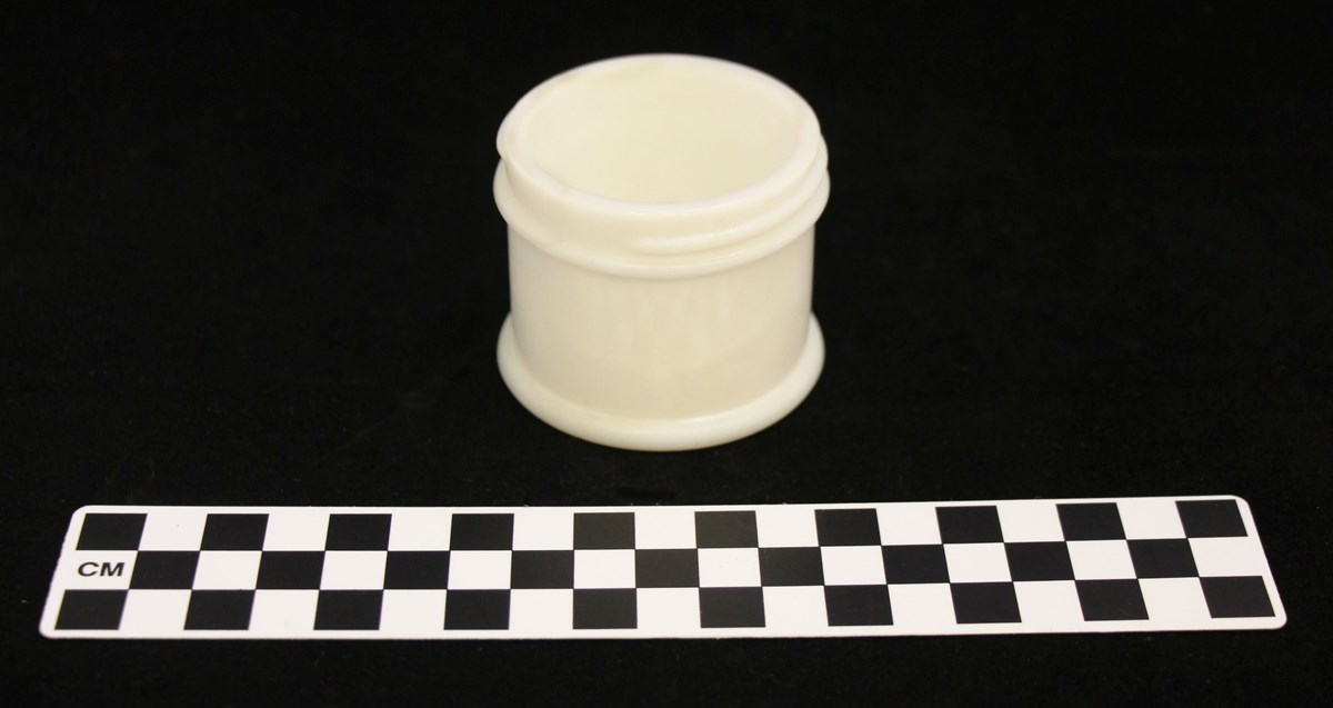 Milk glass cold cream jar. Open with threading on the top for a lid.