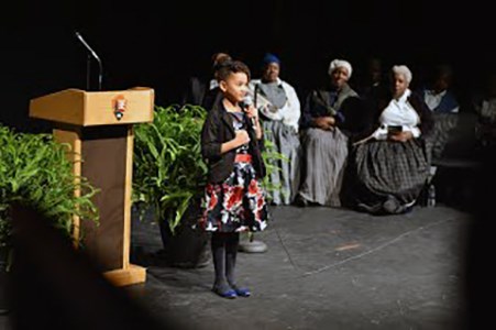 A young girl takes the stage during the weekend's events.