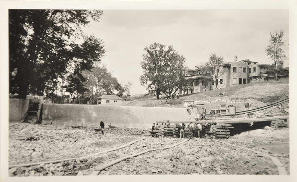 Men constructing the Fair Lane dam near the Fair Lane Mansion in 1915.