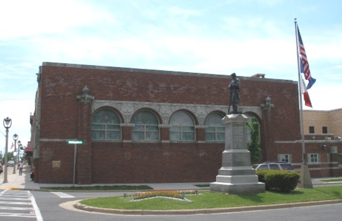 Brick building with arched windows.