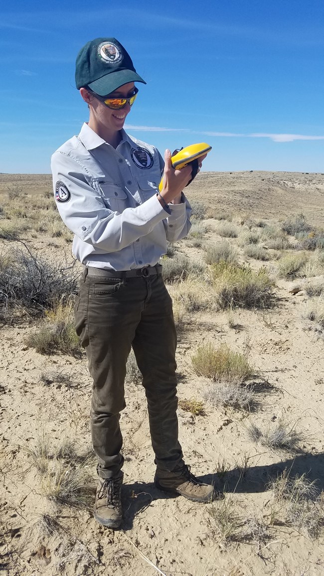 person standing outdoors in arid landscape