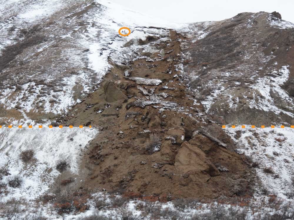 Fig.-2---Igloo-Debris-Slide_web A large landslide covers a road.