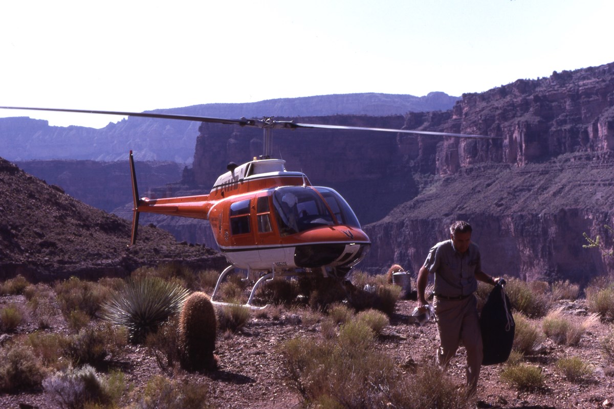 Helicopter dropping off field supplies at Cove Canyon in the Grand Canyon in March 1982.
