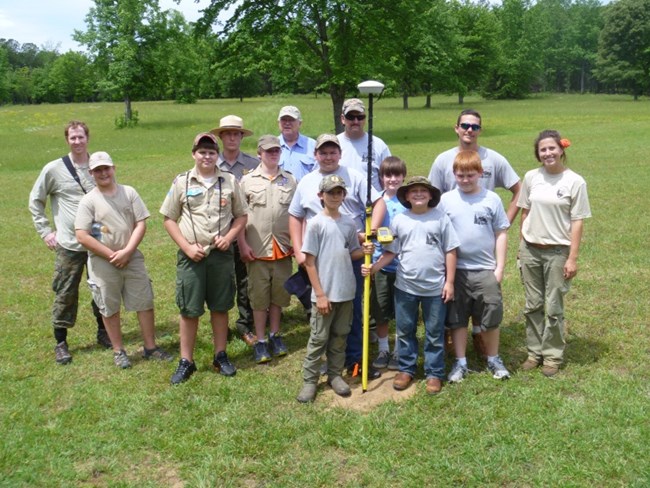 Boy Scouts posing with archeologists at cowpens