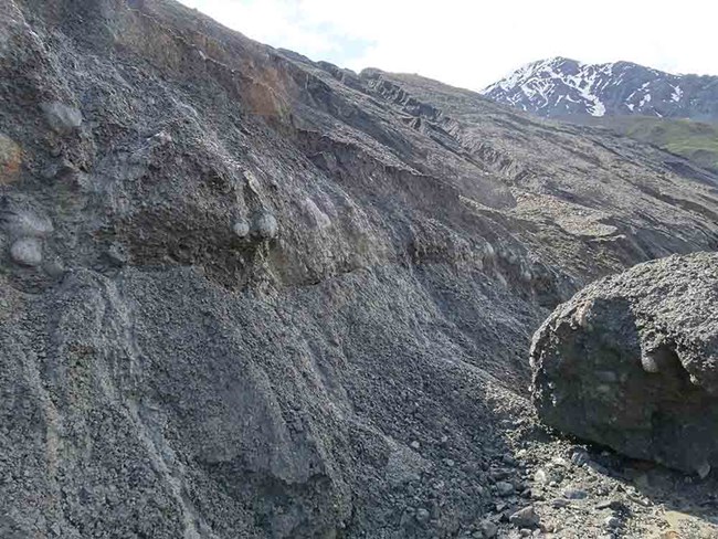 Stream erosion and large deposits from the debris flow.