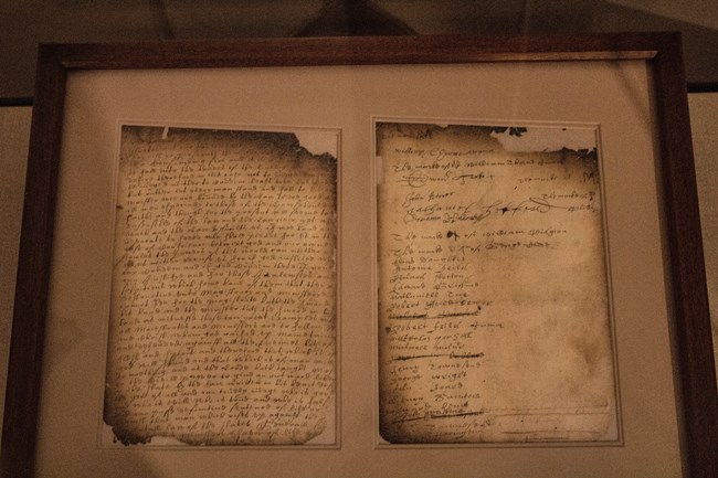 Original Flushing Remonstrance, 1657, document showing damage caused to the document in a fire that swept through Albany in 1911. Two slightly charred pages of an old document in old Dutch