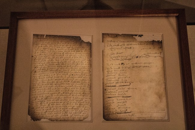 Two slightly charred pages of an old document in old Dutch