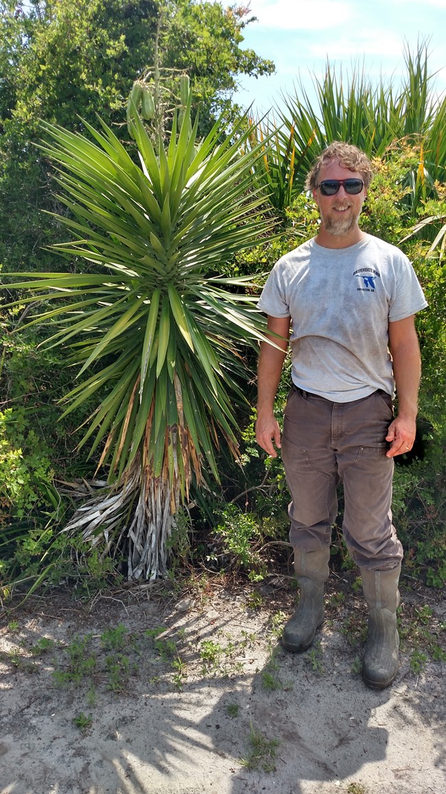 Forbes Boyle standing next to a yucca plant Forbes Boyle standing next to a yucca plant