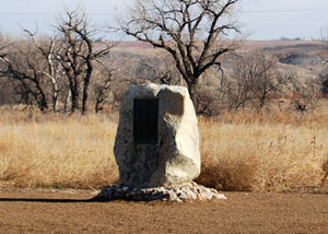 Fort Pierre Marker White rock with a plaque.
