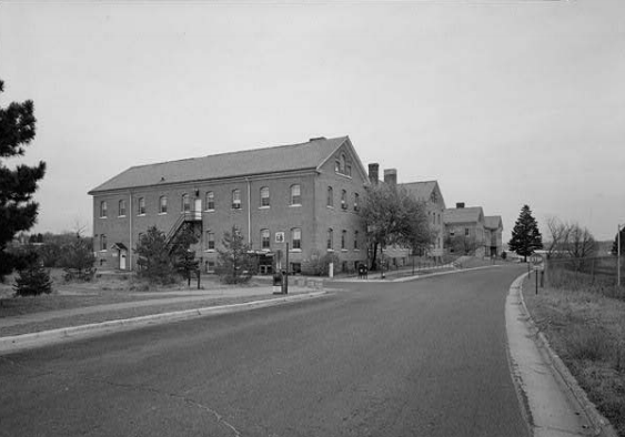 Fort Snelling Building B&W photo of a brick building with a road running in front.
