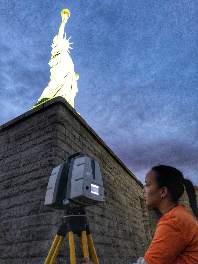 A woman laser scans the walls of Fort Wood A woman laser scans the walls of Fort Wood