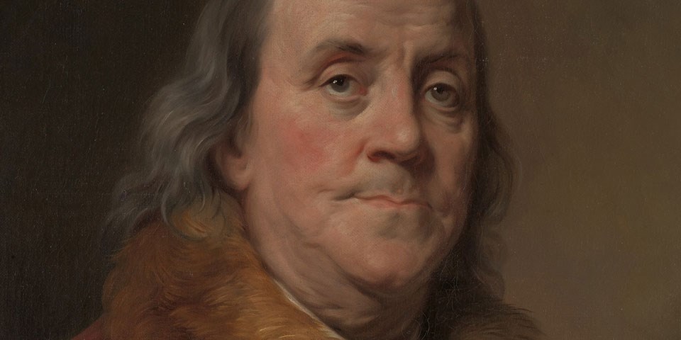 Detail, color portrait of Benjamin Franklin showing an old man with a receding hair line.
