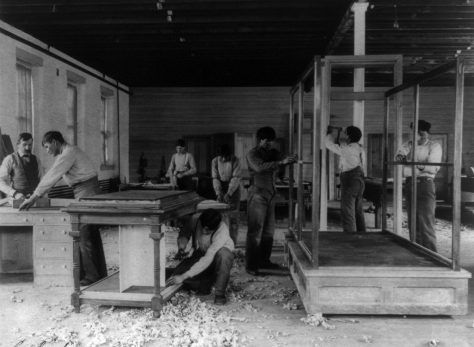 Young men building furniture