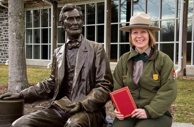 GETT Barbara Sanders Barbara Sanders sitting next to a statue of Abraham Lincoln