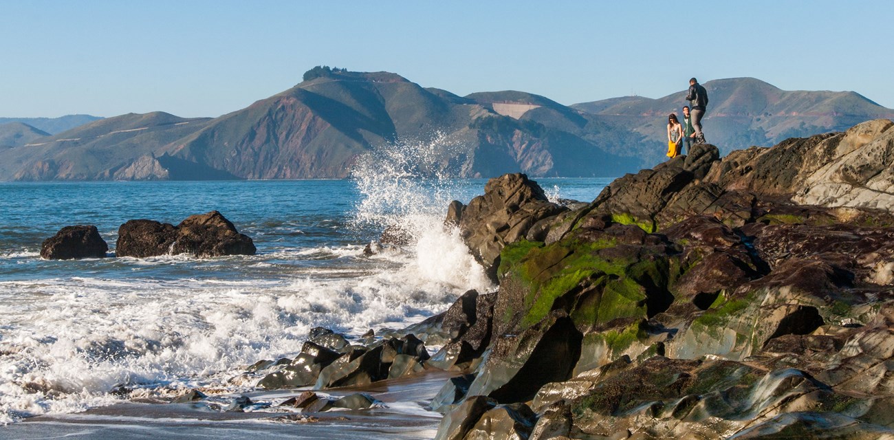 waves breaking on beach and rocks