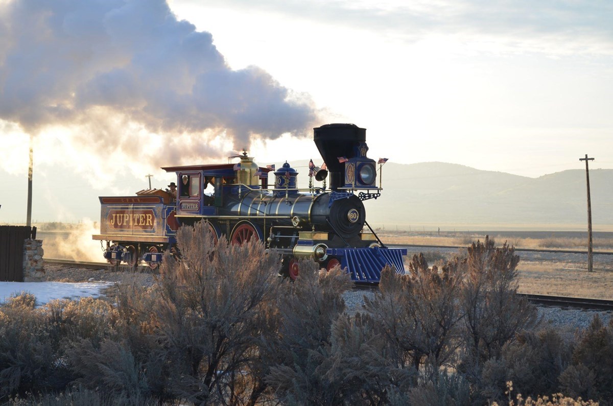 GOSP Jupiter Steam locomotive running on a railroad track in winter