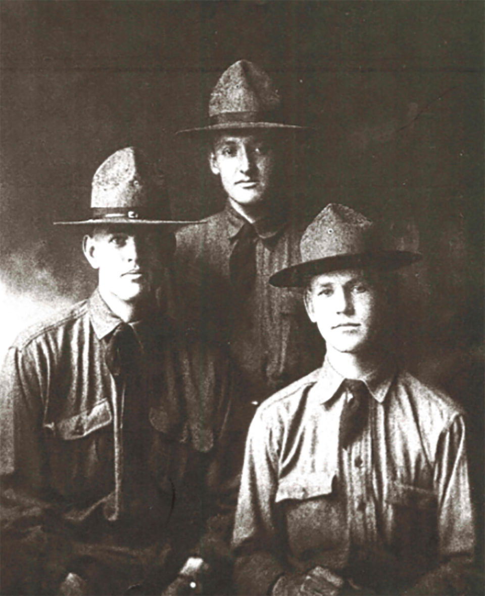 Three men of different generations in WWI uniforms