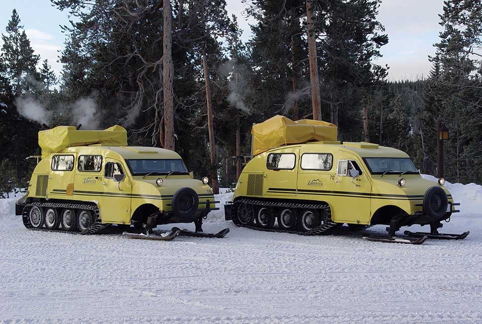 Large yellow snowcoaches