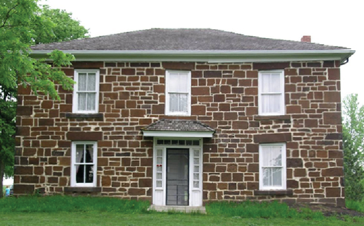 Brick building on a green lawn.