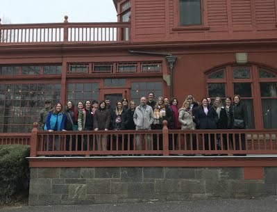 Attendees stand on the porch of Thomas Edison's home, Glenmont