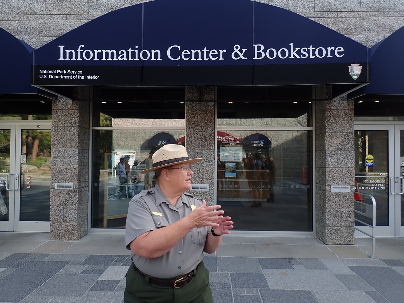 A national park staff member explains the history of Mount Rushmore.