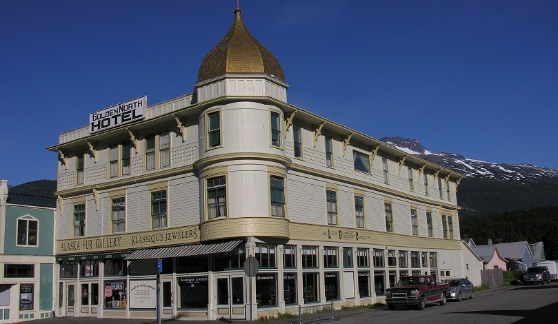 Three story hotel with golden dome