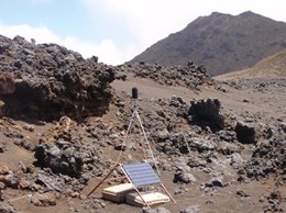 Equipment at Haleakala National Park used to determine the sound impacts of aviation over the area. Equipment set up in a dry rocky mountainous area.