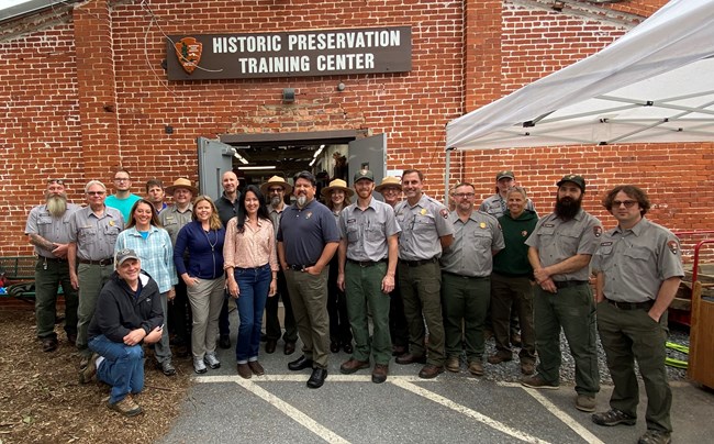 Assistant Secretary of the Interior for Fish and Wildlife and Parks Shannon Estenoz and NPS Director Chuck Sams visit with employees of the NPS Historic Preservation Training Center