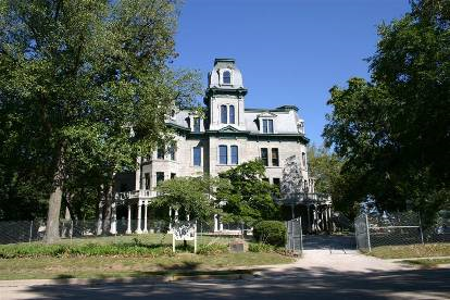 Hegler-Carus Mansion Large grey building with a large porch.