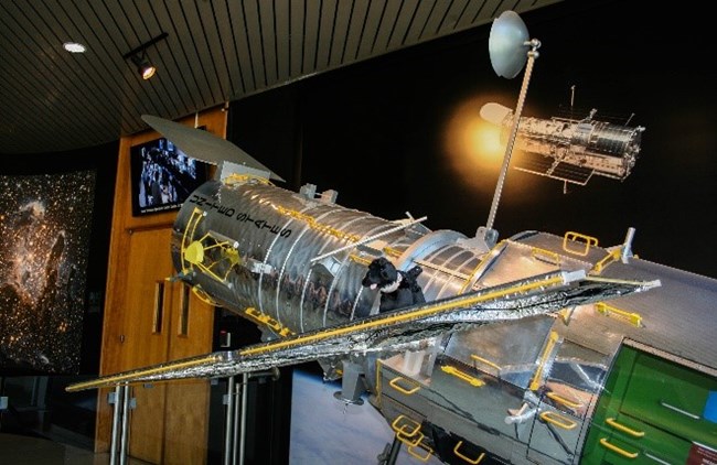 Hubble toy dog on model of the HUbble Space Telescope